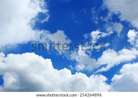 Cumulus clouds hung in the blue sky