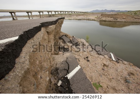 Road washed out by flood in Arizona desert.