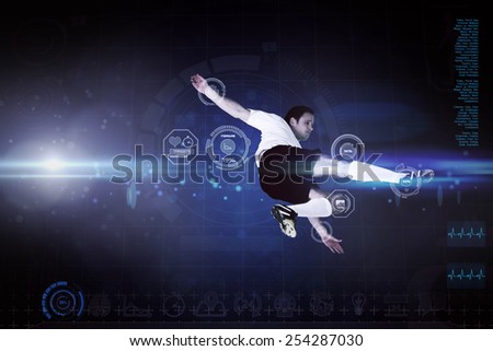 Football player in white kicking against blue dots on black background