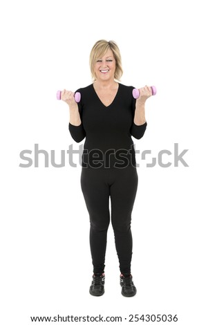 Middle aged woman doing exercise with dumbbells against a white background