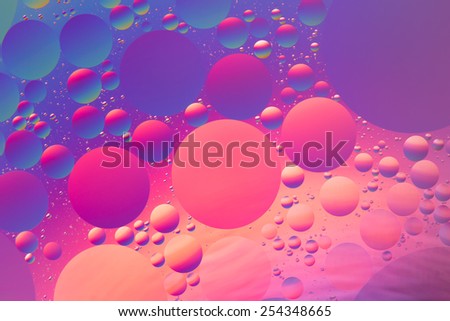 Purple, orange, red and blue psychedelic oil and water abstract, unfocused