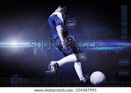 Football player kicking ball against blue dots on black background
