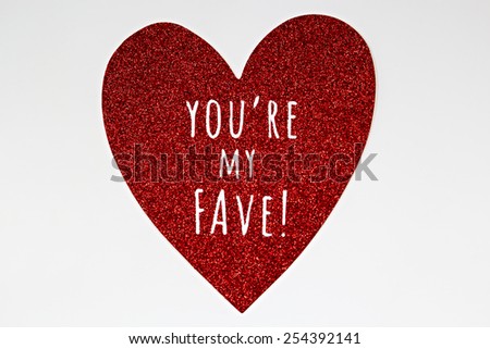 Large red glitter heart with message saying you're my fave or favorite
