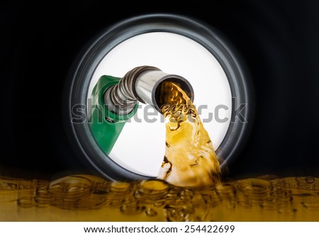 Refilling fuel view from inside of gas tank of a car Royalty-Free Stock Photo #254422699