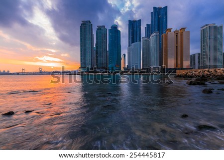 building with skyscrapers at sunset