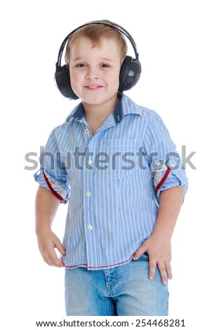 Positive little boy in big black headphones. Isolated on white.