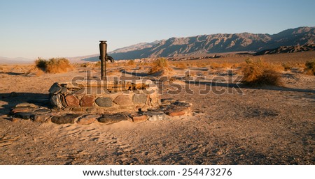 Hardware from a historic well still lives in Death Valley National Park Royalty-Free Stock Photo #254473276