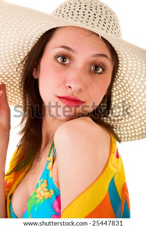 Beautiful girl in summer hat looking archly