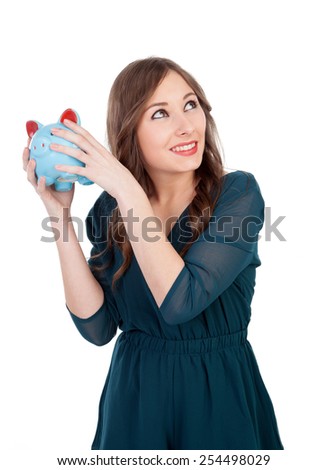 Smiling young girl with a blue money-box isolated on a white background