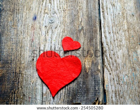 Red heart on a wooden background 