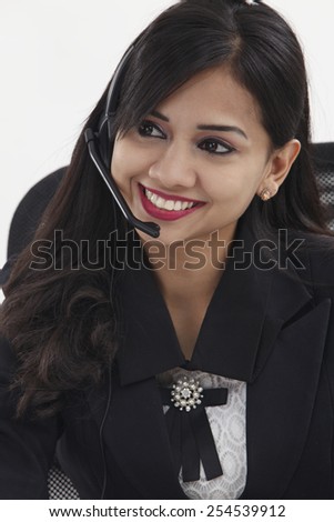 beatiful receptionist wearing head set talking