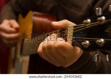 Playing a chord on guitar