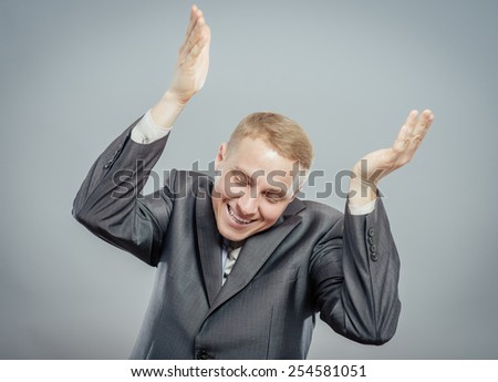 Closeup portrait happy successful business man winning, fists pumped celebrating success isolated grey wall background. Positive human emotion, facial expression. Life perception, achievement