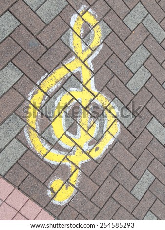 music treble clef on the pavement of ceramic tiles