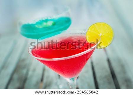 Beautiful red cocktail with lemon. Restaurant