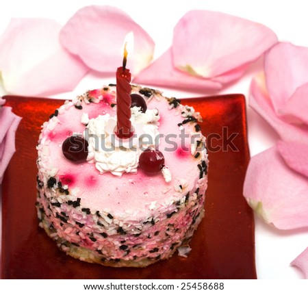 cake with candle and pink rose