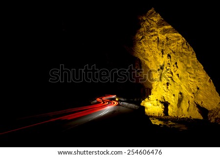 red and white Car light trails in the tunnel. Art image . Long exposure photo