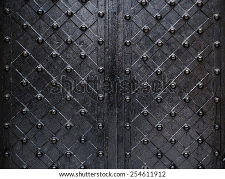 metallic texture black elements of the old door.