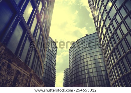 Enormous building and sky. Much metal. Very beautiful geometry of consruction. A wonderful cine color. Instagram filter efect. Picture for printing to the wall and for editions. Dramatic landscape