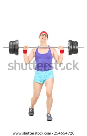 Full length portrait of a nerdy athlete attempting to lift a weight isolated on white background
