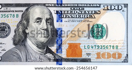 Macro shot of a new 100 dollar bill. Royalty-Free Stock Photo #254656147