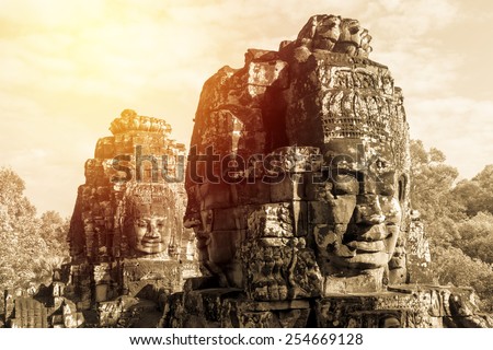 Ancient Bayon castle, Angkor Thom, Cambodia. Vintage filter. Royalty-Free Stock Photo #254669128