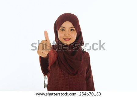 attractive woman with scarf showing thumbs up
