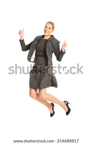 Picture of a cheerful jumping businesswoman