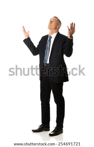 Full length businessman with hands open gesture.
