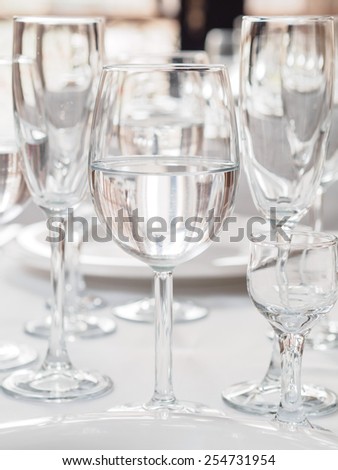 Glasses and plates on table in restaurant
