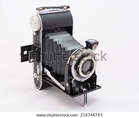 Old photo camera, isolated white background