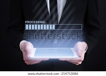 businessman holding a tablet with loading bar  on the screen. Internet concept. business concept.