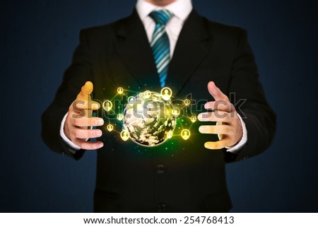 Businessman holding a shining globe with social media connection 