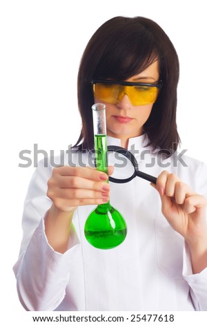 Female scientist looking at tube through magnifying lens
