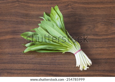 Fresh green onion on wooden desk