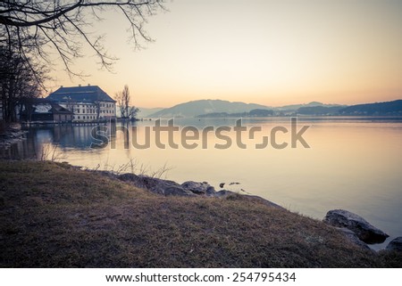 Schloss Kammer and Seewalchen on lake Attersee in wintertime with snow.