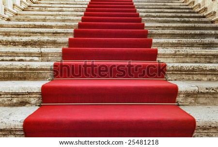 Ancient stairs covered with red carpet