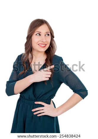 Young girl pointing with the finger isolated on a white background