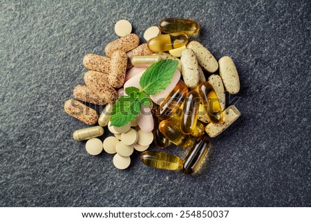 pills and multivitamins Royalty-Free Stock Photo #254850037