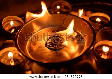 Ancient pentagram burning at altar close up Royalty-Free Stock Photo #254870998