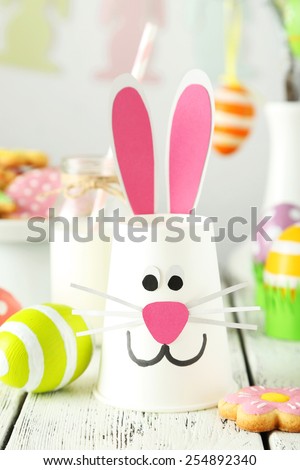 Beautiful easter rabbit on white wooden background