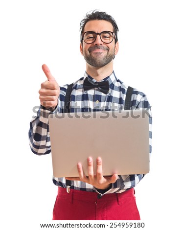 Posh boy with laptop over white background 