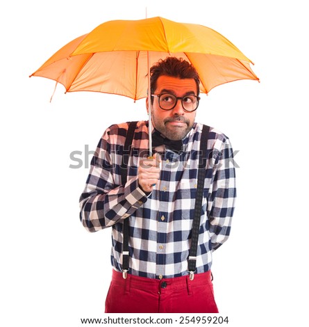 Posh boy holding an umbrella 