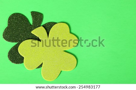 Two Shamrock Leaves on Green Background. St. Patrick's Day