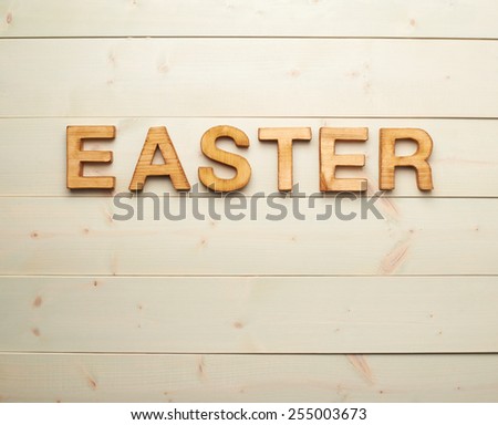 Word Easter made of wooden letters as a festive Easter background composition