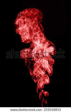 Abstract red smoke on black background.
