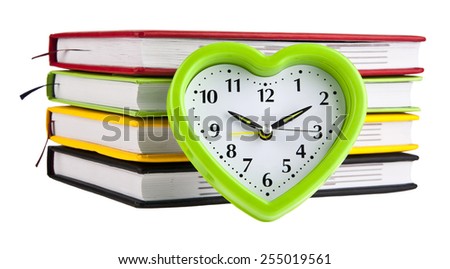 books and clock on a white background