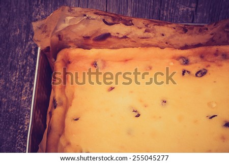 Vintage photo of homemade cheesecake in baking tray