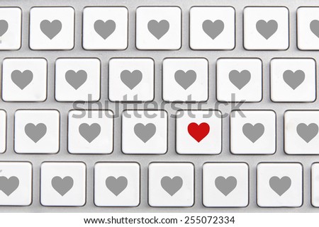 White keyboard with an icon of red heart on the buttons