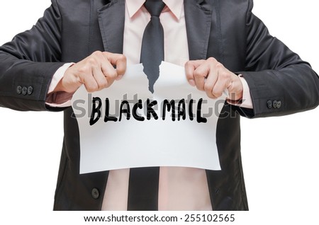 Businessman ripping up the BLACKMAIL sign on white background